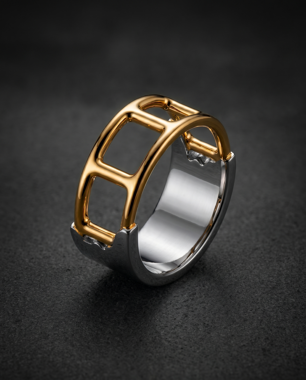 Wide ring with an open architectural cut-out structure in gold and silver