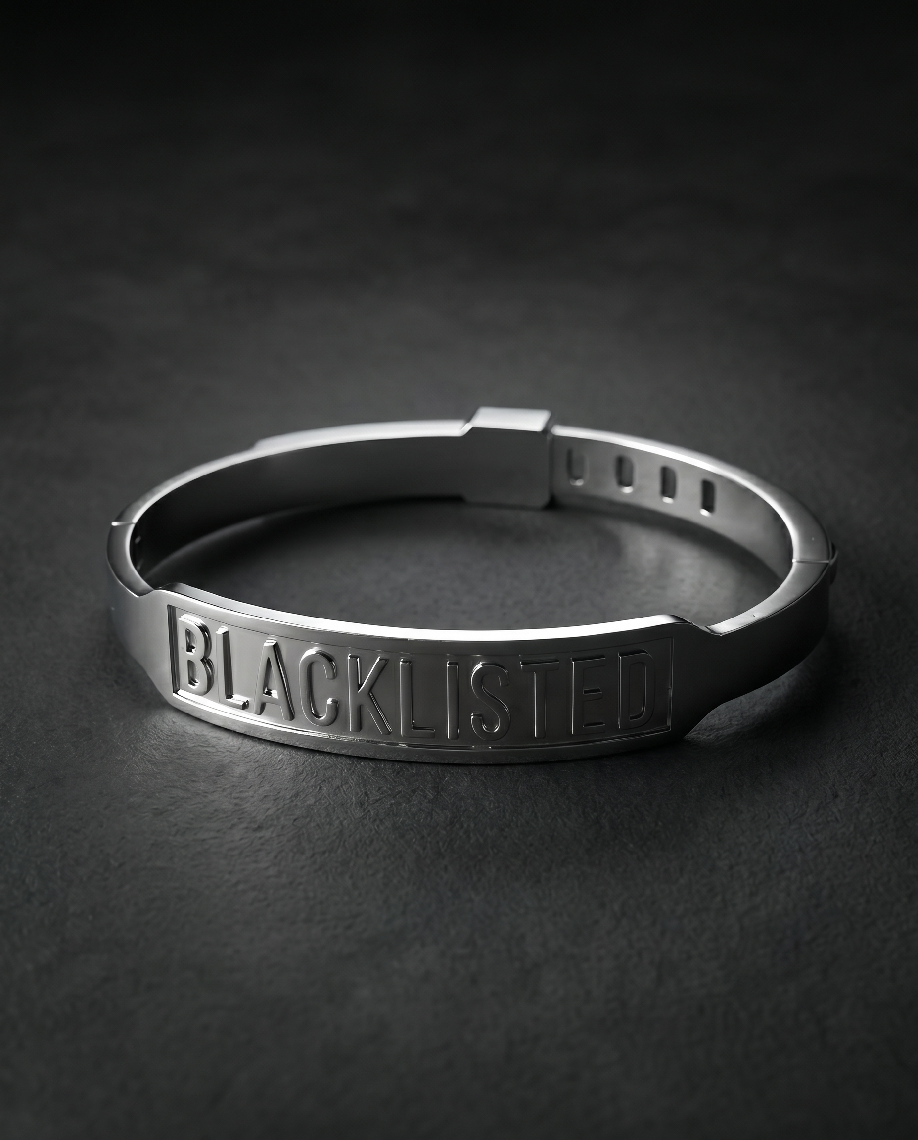 Silver cuff bracelet engraved with the word BLACKLISTED