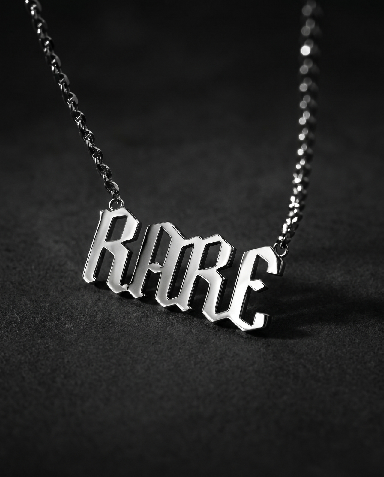 Silver pendant spelling RARE in sculpted 3D gothic letters