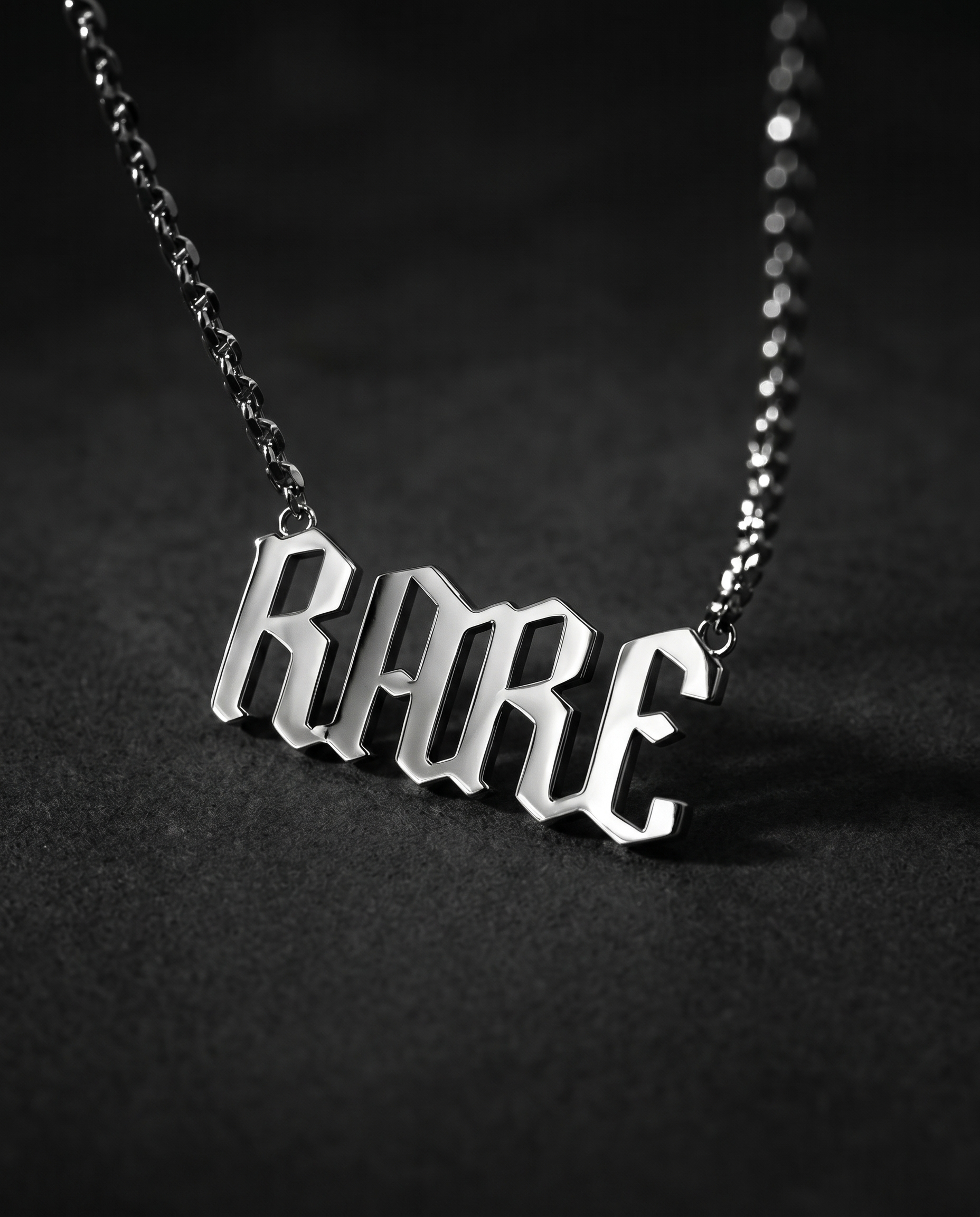 Silver pendant spelling RARE in sculpted 3D gothic letters