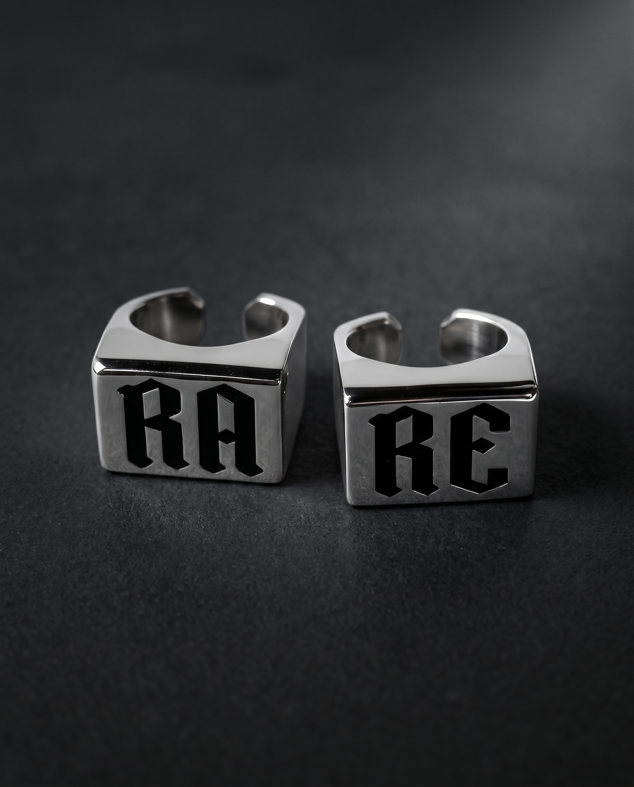 Set of two silver signet rings with gothic RA and RE lettering