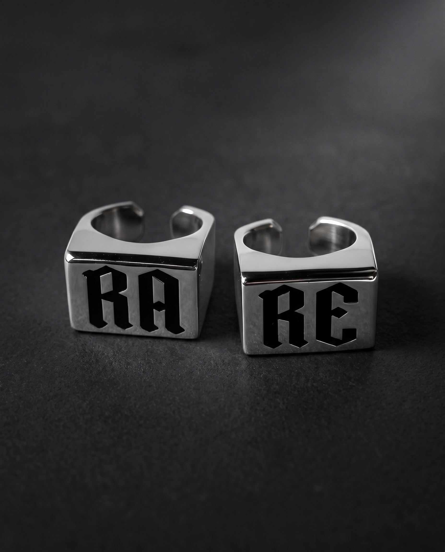Set of two silver signet rings with gothic RA and RE lettering